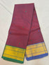 Deep maroon Kanchi cotton saree with subtle woven buttas and dual contrast green and blue gold zari borders with running blouse piece.