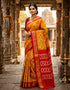 Full length view of an authentic mustard yellow Pochampally Ikkat silk saree featuring a diamond geometric body and a rich maroon zari pallu.