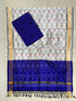 Off-white and royal blue Pochampally Ikat silk unstitched dress material set featuring handwoven elephant motifs, a detailed diamond and temple pattern border, and black and yellow tassels.