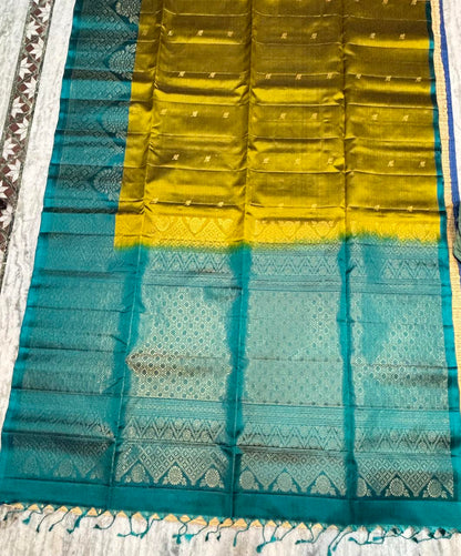 Mustard olive green Kanchipuram soft silk saree with intricate peacock teal zari pallu and Silk Mark certification