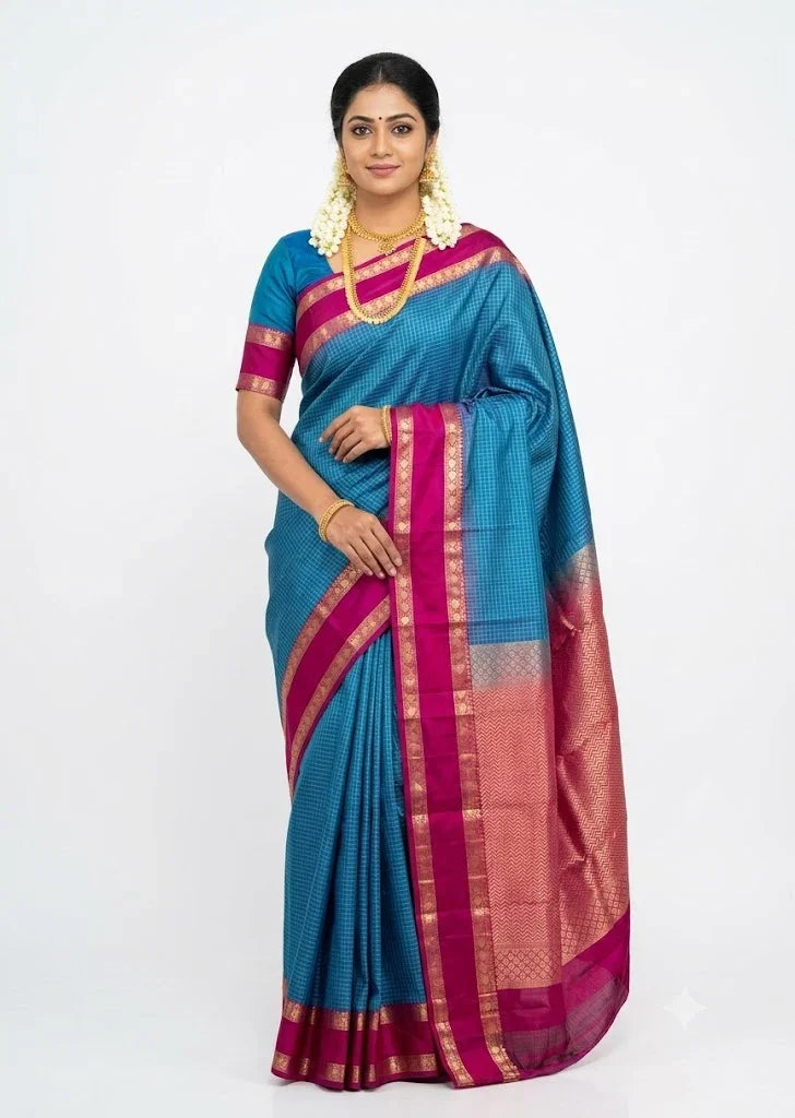 Model wearing peacock blue and magenta Kanchipuram pure silk saree with gold temple border