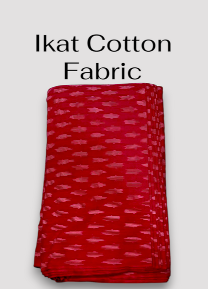 Folded vibrant pinkish-red Pochampally Ikat cotton fabric featuring a repeating white horizontal woven pattern.