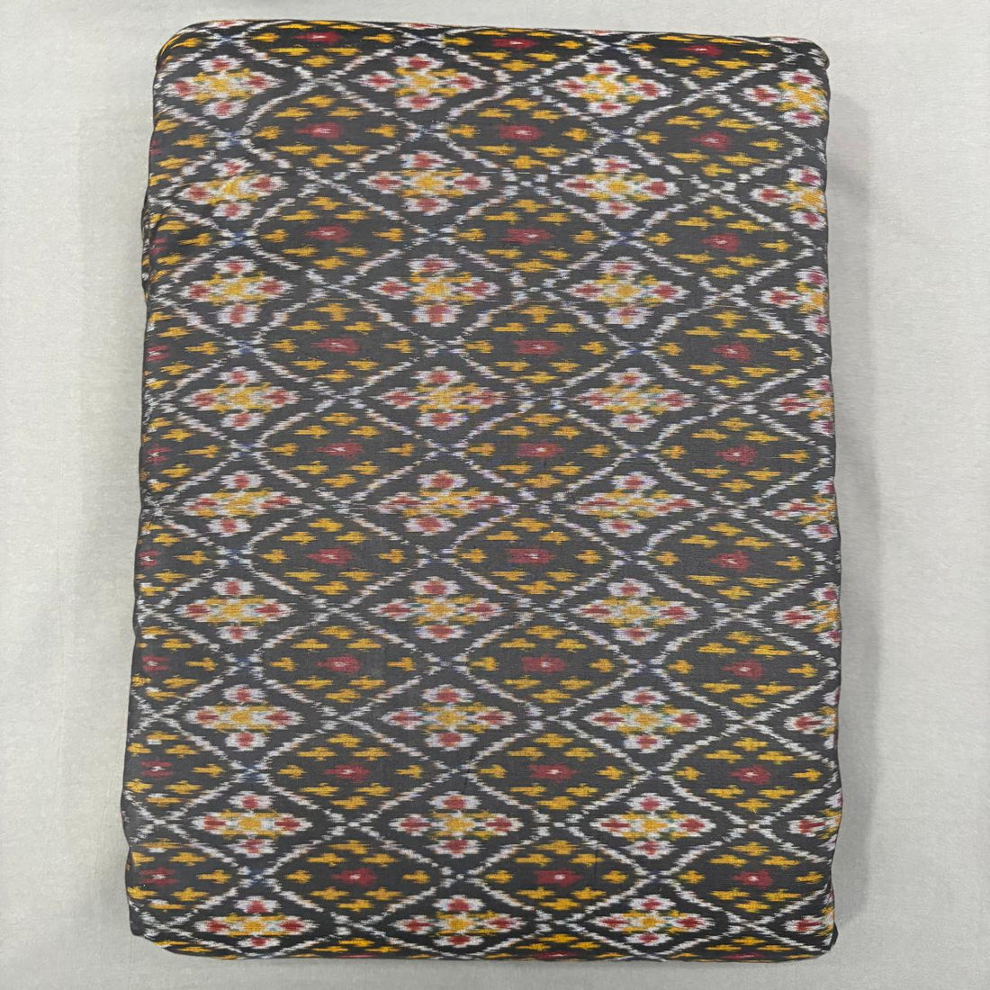 Handwoven Pochampally Ikkat Sico charcoal black fabric with  yellow and red diamond Ikat motifs
