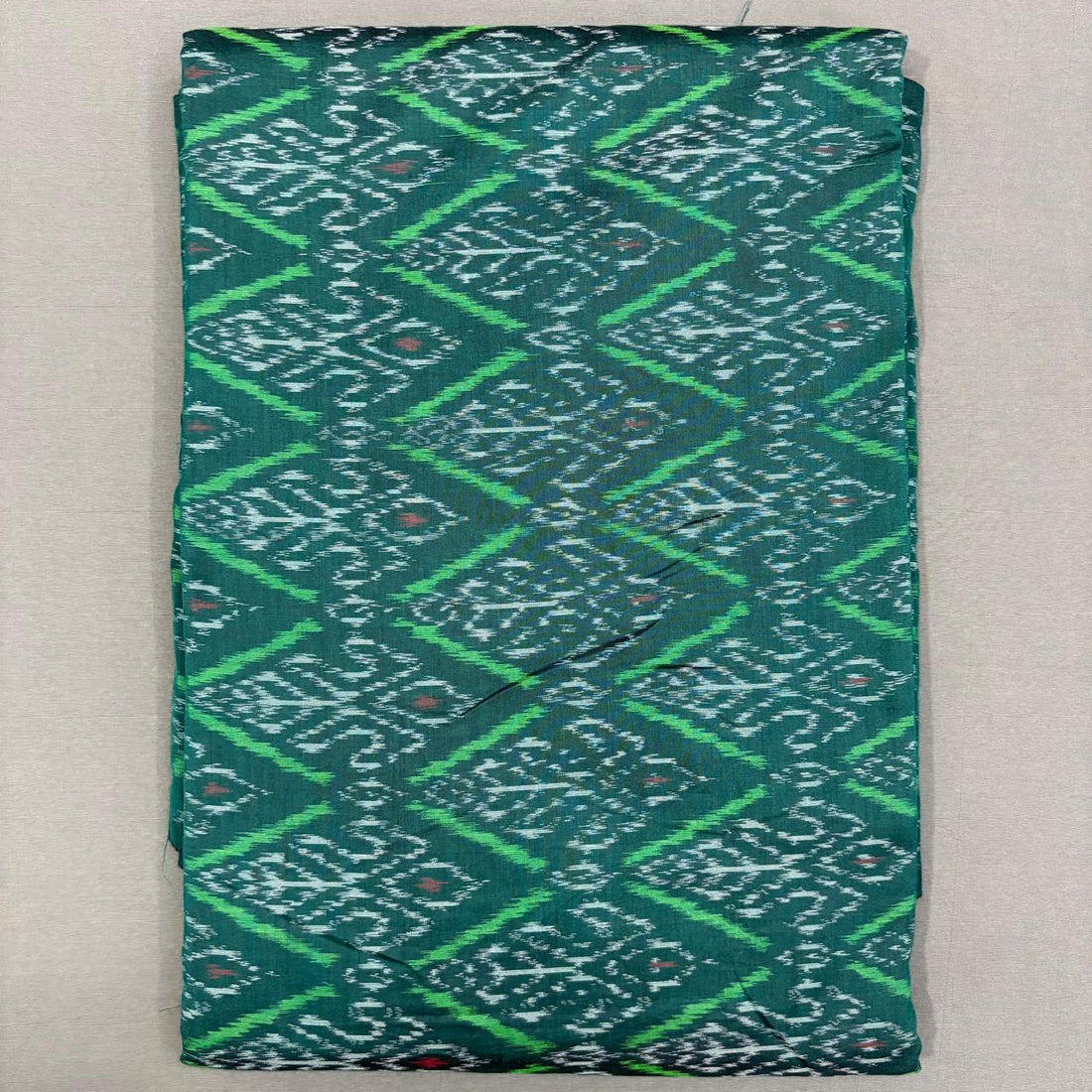 Handwoven Pochampally Ikkat Sico forest green dress material fabric with bright green diamond motifs