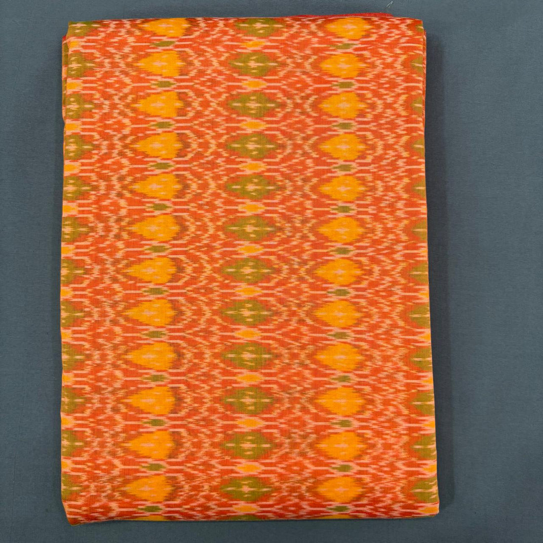 Handwoven Pochampally Ikkat Sico orange and yellow patterned dress material fabric