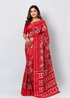 Model wearing authentic red pure Ikkat Patola silk handloom saree with traditional woven zari border