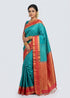 Indian model draped in a Silk Mark certified cyan teal Kanchipuram pure silk saree with a traditional red zari border and rich brocade pallu