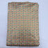 Folded beige cream pure silk Ikat fabric featuring delicate multicolored geometric arrow motifs with Silk Mark certification.