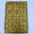 Folded golden mustard yellow pure silk Ikat fabric featuring olive green and terracotta rust geometric motifs with Silk Mark certification.