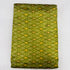Folded olive green pure silk Ikat fabric featuring geometric golden yellow and rust diamond motifs with Silk Mark certification