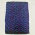  Folded royal blue pure silk Ikat fabric featuring sky blue geometric diamond lattice with magenta and olive motifs with Silk Mark certification.
