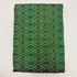 Folded mint sea green pure silk Ikat fabric featuring geometric diamond lattice with olive brown and mustard motifs with Silk Mark certification.   