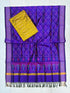 Deep purple and mustard yellow Pochampally Ikat silk unstitched dress material set featuring handwoven floral motifs, a geometric patterned top, a multi-colored temple border, and knotted tassels.