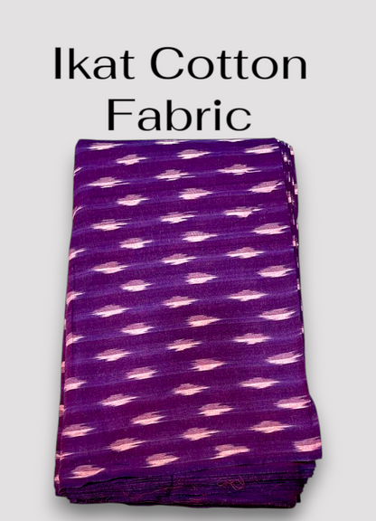 Folded deep purple Pochampally ikat cotton handloom fabric with woven motifs