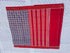 Flat lay of an authentic double ikat patola silk saree with a deep purple geometric patterned body, red striped pallu, and Silk Mark certification