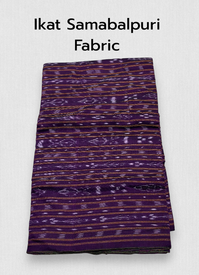 Folded dark purple Sambalpuri Ikat cotton fabric featuring traditional horizontal woven motifs in lavender and orange, displayed on a wooden surface next to artisan wooden blocks.