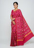 Model wearing a real handwoven Rani pink Patan Patola pure silk saree with traditional elephant and parrot ikat patterns