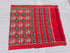 Flat lay of a traditional red Patola silk saree featuring woven elephant and geometric floral motifs with a striped pallu