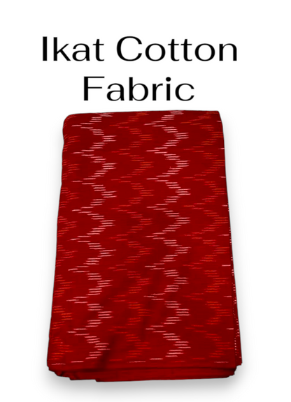 Folded deep red handloom Pochampally ikat cotton fabric with white woven pattern