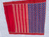 Flat lay of an authentic double ikat patola silk saree with a royal blue geometric patterned body, red striped pallu, and Silk Mark certification