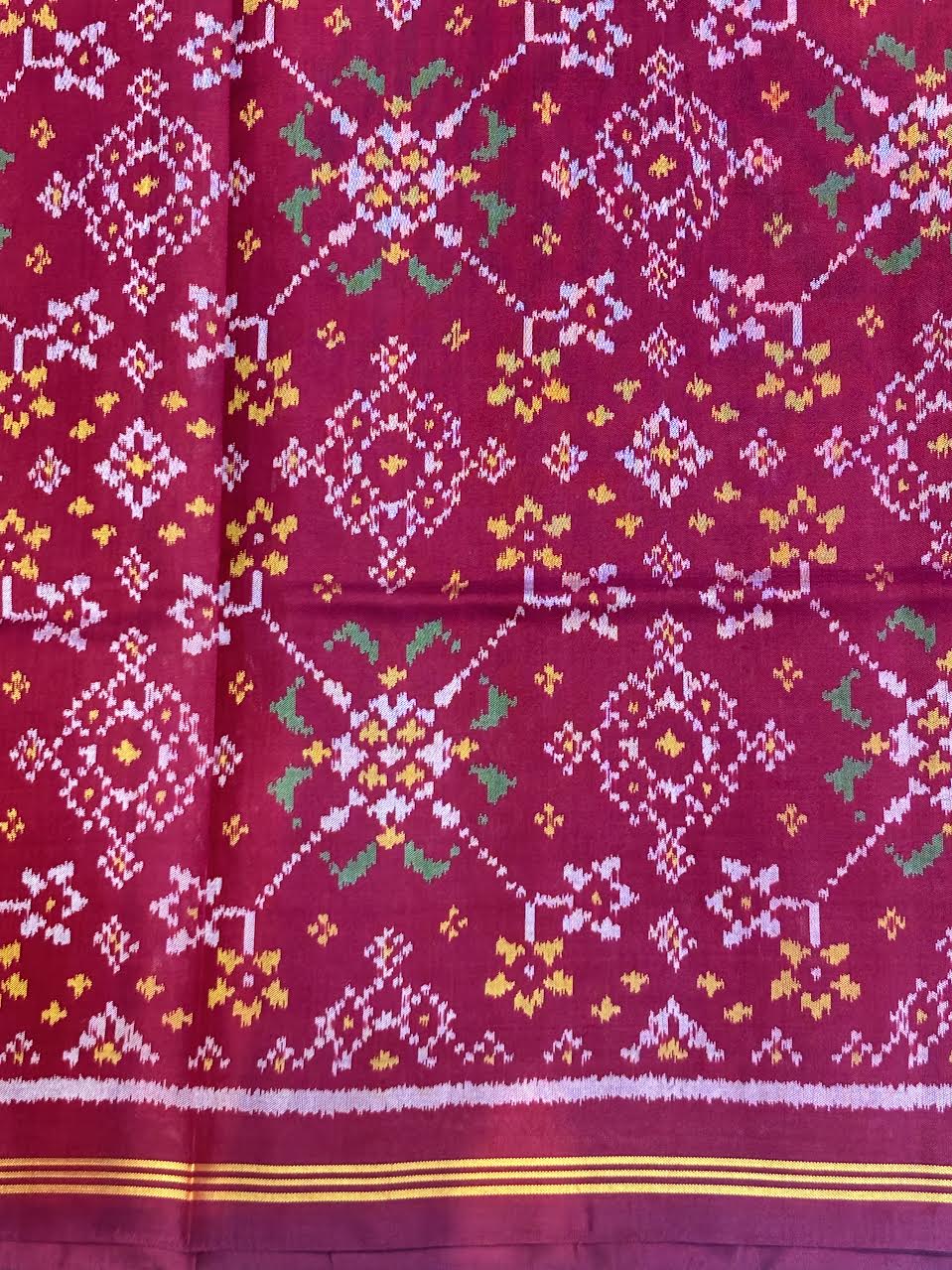 Maroon Real Ikkat Patola Silk Saree with Geometric Weave and Figural Border