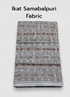 Folded Sambalpuri Ikat cotton fabric featuring traditional brown, black, and off-white horizontal woven patterns.