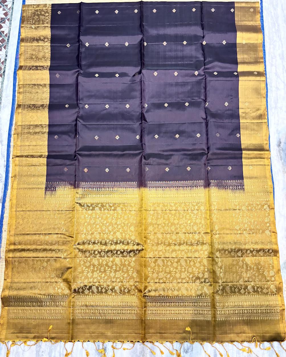 Silk Mark certified midnight purple Kanchi soft silk saree featuring gold zari butis and a heavy gold brocade pallu with tassels