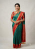 Model wearing a Silk Mark certified peacock green Kanchipuram pure silk saree with a traditional red zari border and rich pallu