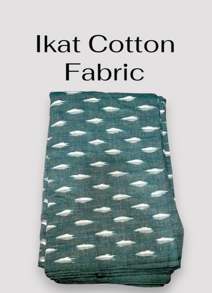 Handloom teal green Pochampally ikat cotton fabric featuring woven off-white geometric dash motifs